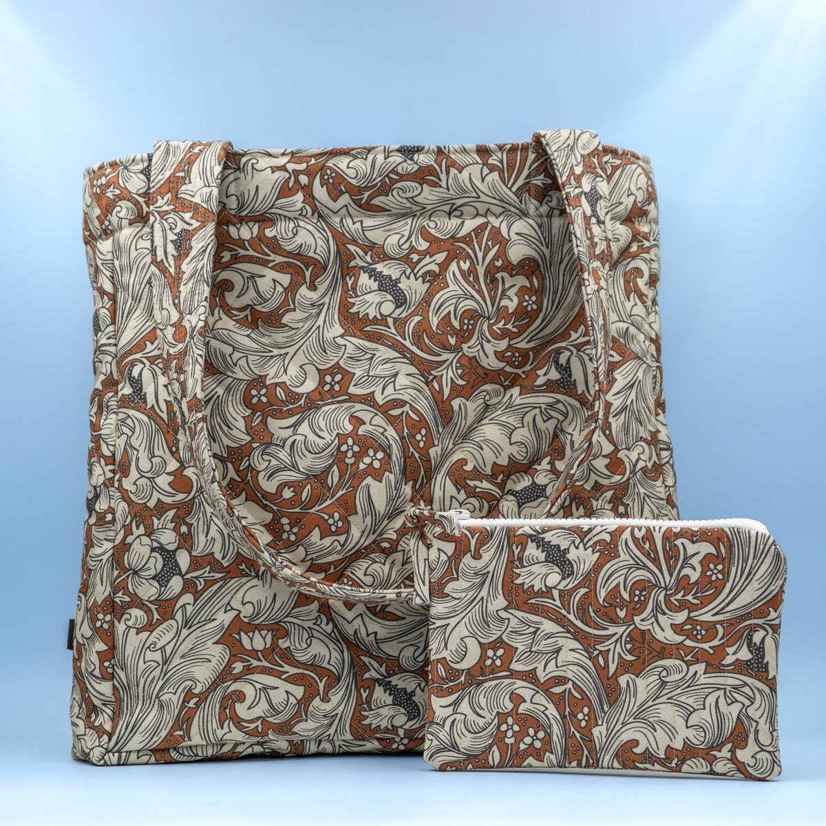 Quiltet clutch liten brun med paisley