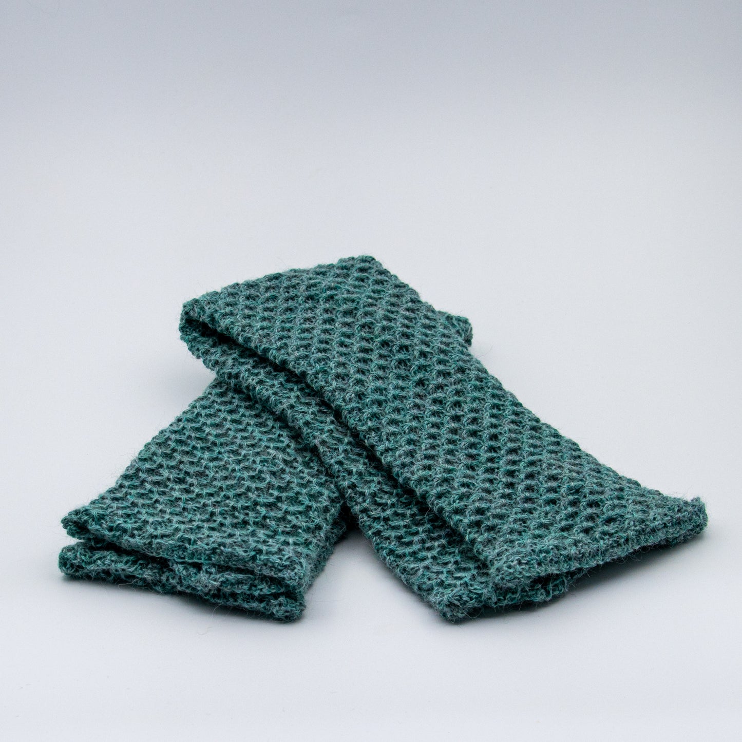 Leggvarmere alpakka melert mørk turkis