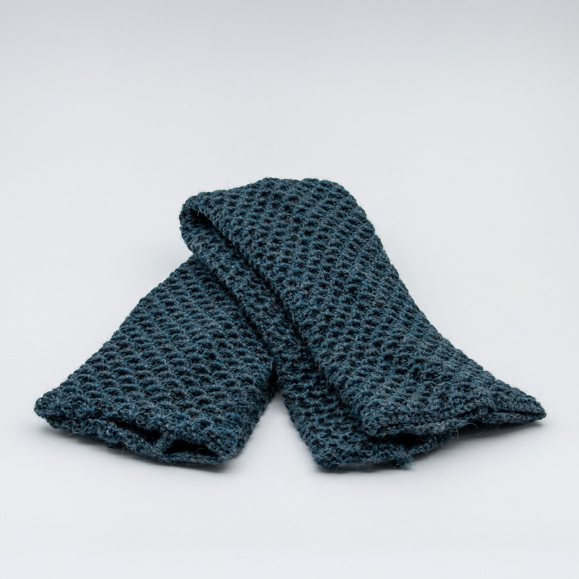 Leggvarmere alpakka melert mørk aqua - PREG Interiør