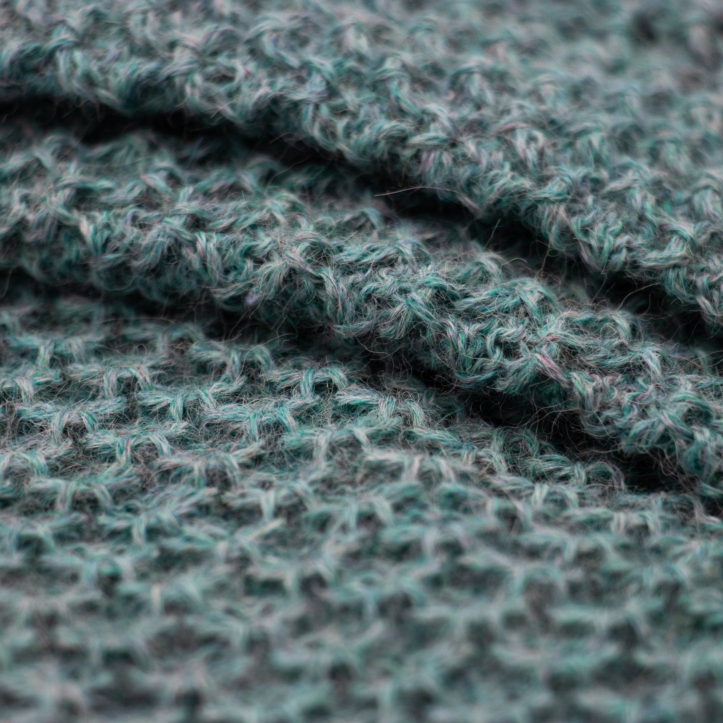 Leggvarmere alpakka melert mørk turkis - PREG Interiør