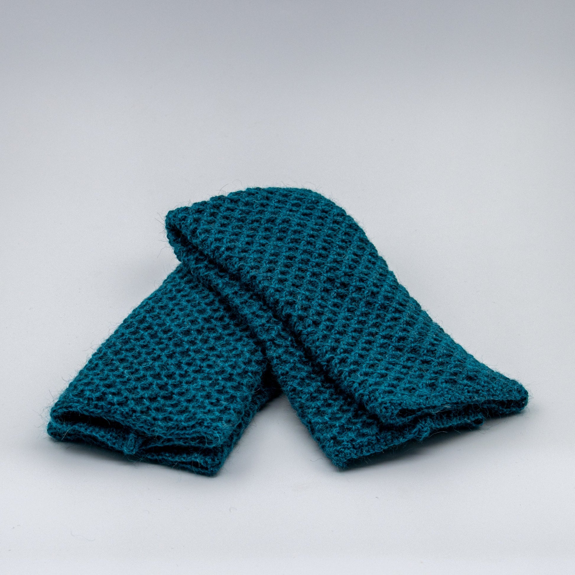 Leggvarmere alpakka melert petrol - PREG Interiør