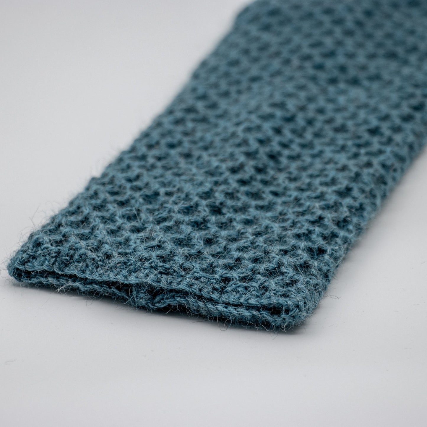 Leggvarmere alpakka melert petrol - PREG Interiør