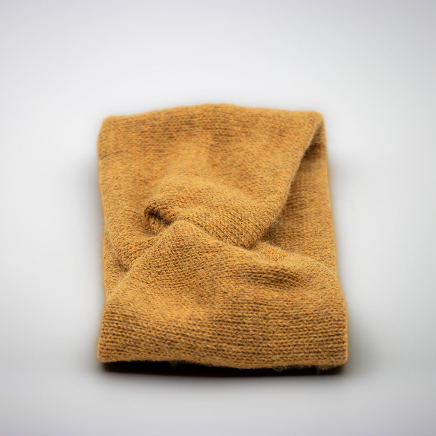 PANNEBÅND TVIST ALPAKKA MELERT HONNING - GUL - PREG Interiør