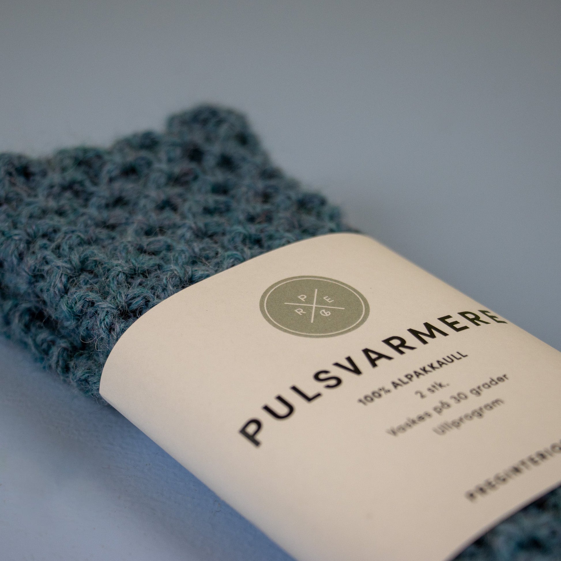 Pulsvarmere alpakka melert lys blå - PREG Interiør