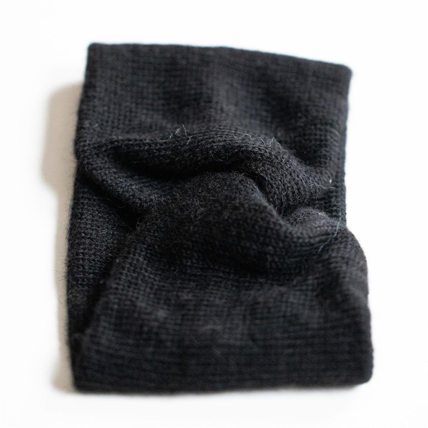 PANNEBÅND TVIST ALPAKKA SORT - PREG Interiør