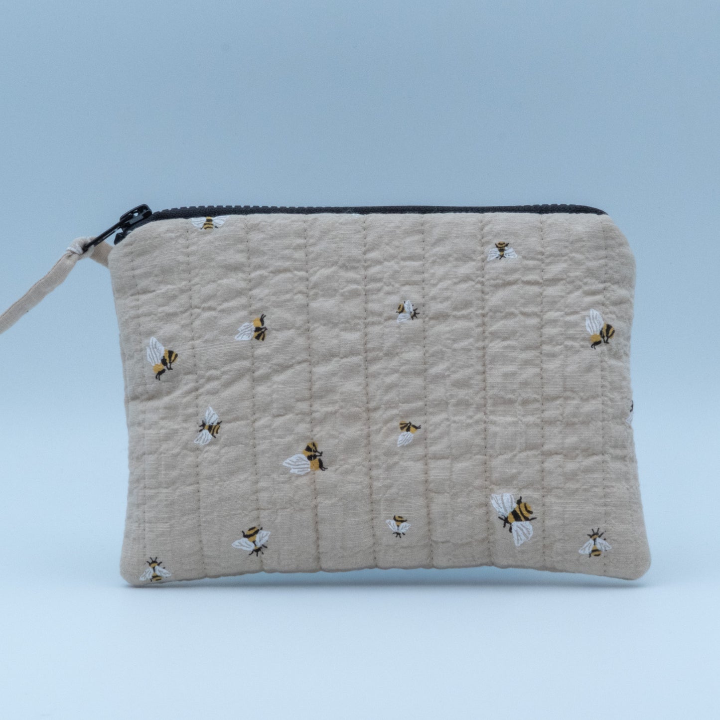 Quiltet clutch liten sand med bier
