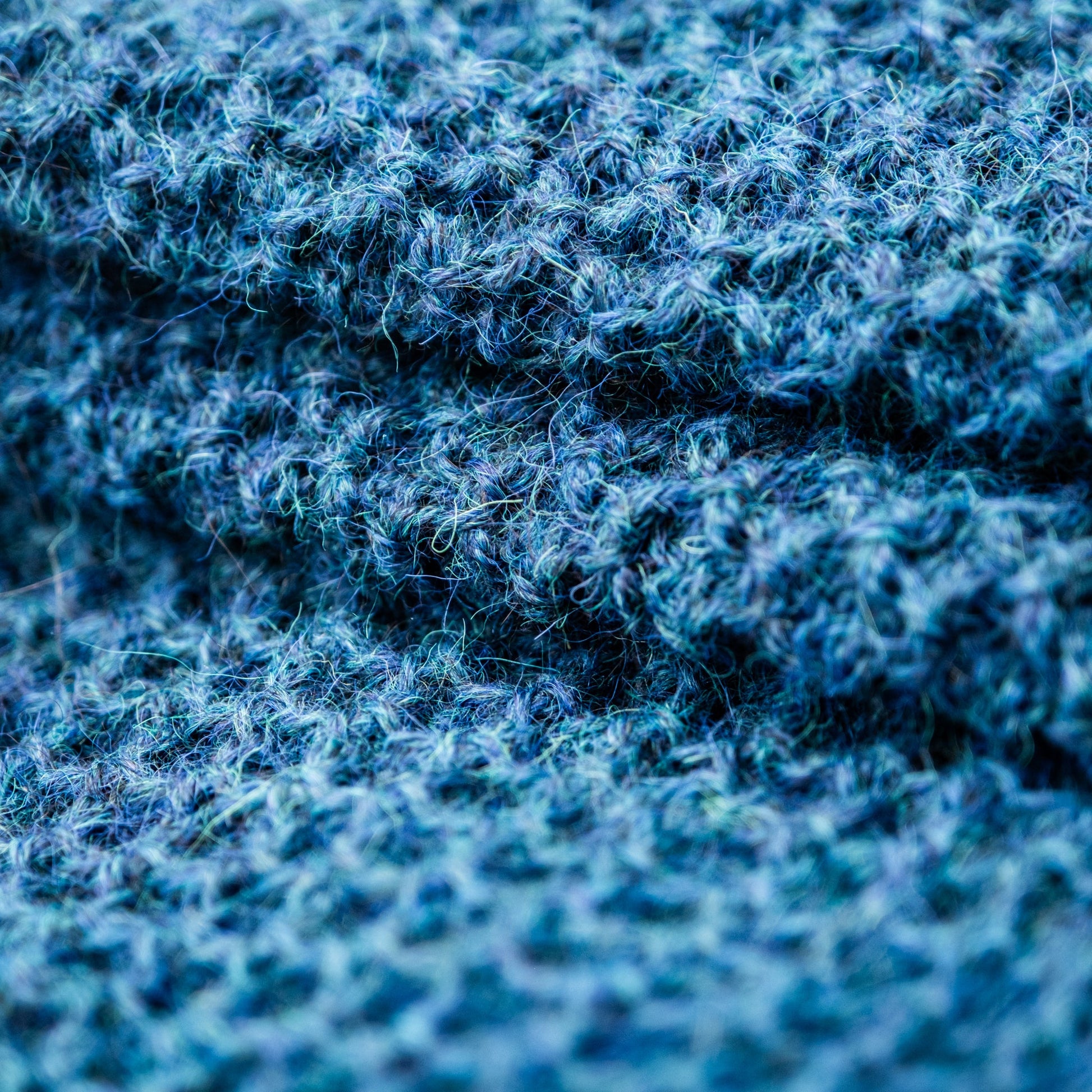 Leggvarmere alpakka melert mørk petrol - PREG Interiør