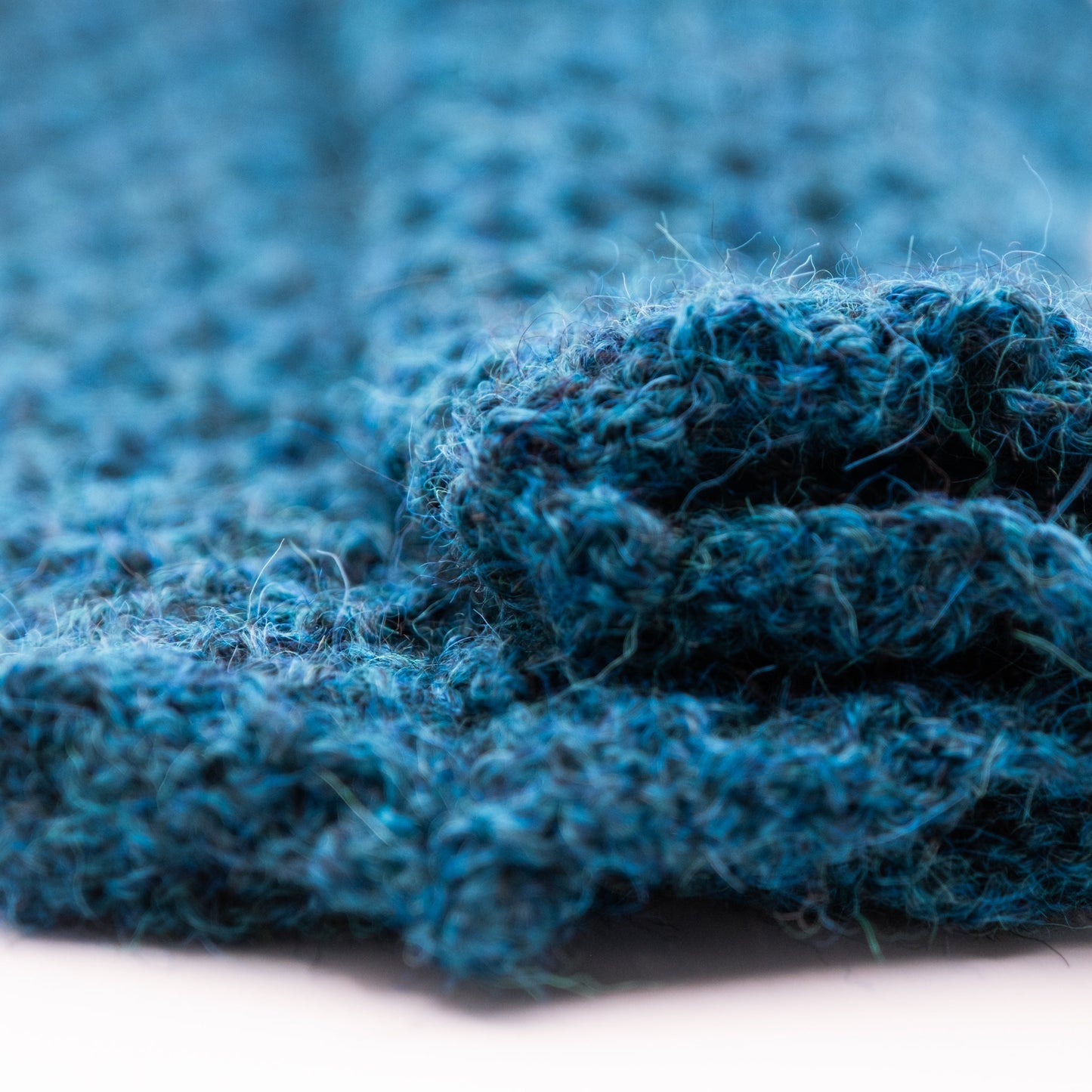 Pulsvarmere alpakka melert mørk petrol - PREG Interiør