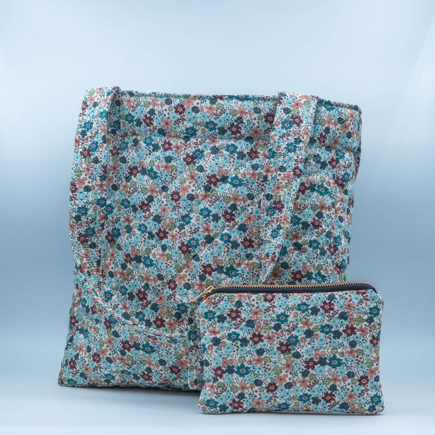 Quiltet clutch liten offwhite med blomster - PREG Interiør