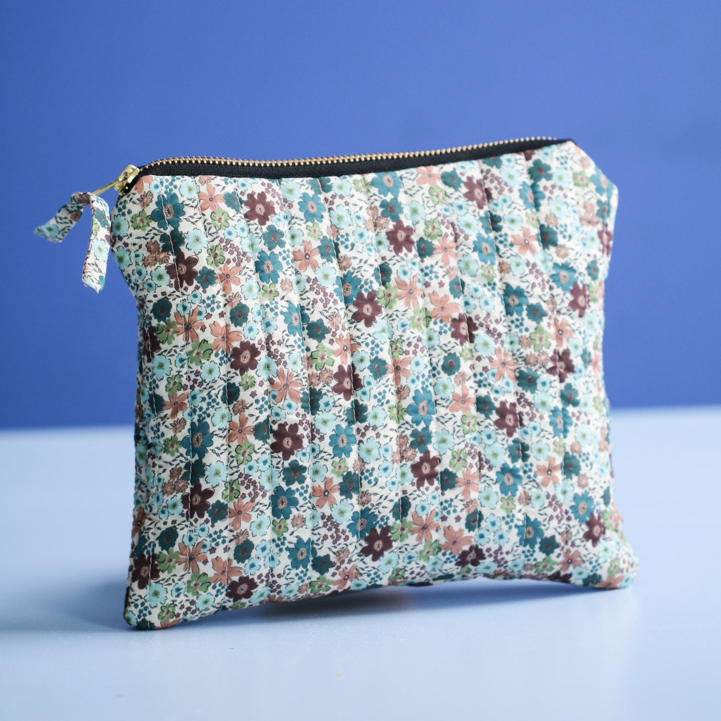 QUILTET CLUTCH OFFWHITE MED BLOMSTER